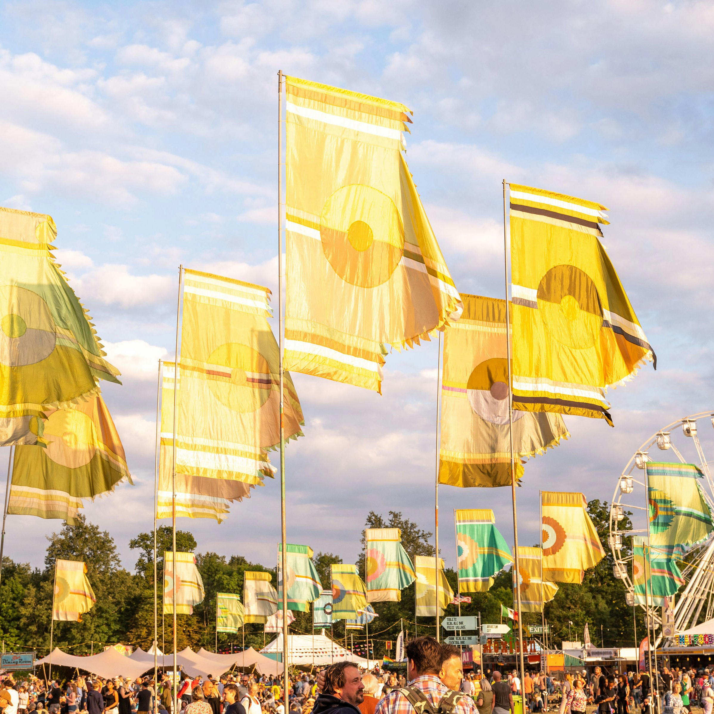 Yellow flags adorn the Womad site as the sun sets on its first day reigning in the 40th anniversary celebration WOMAD England 2022